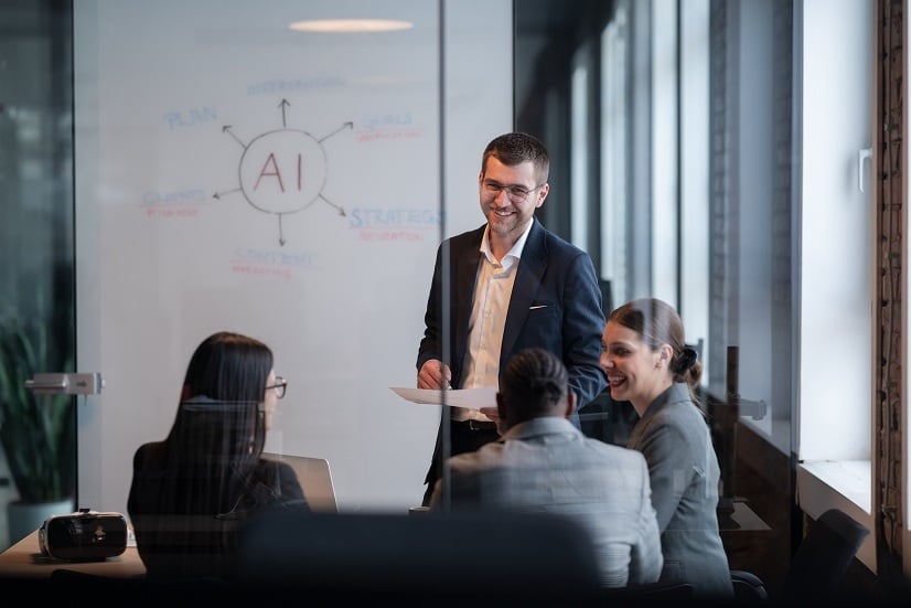 Man presenting about AI in meeting room