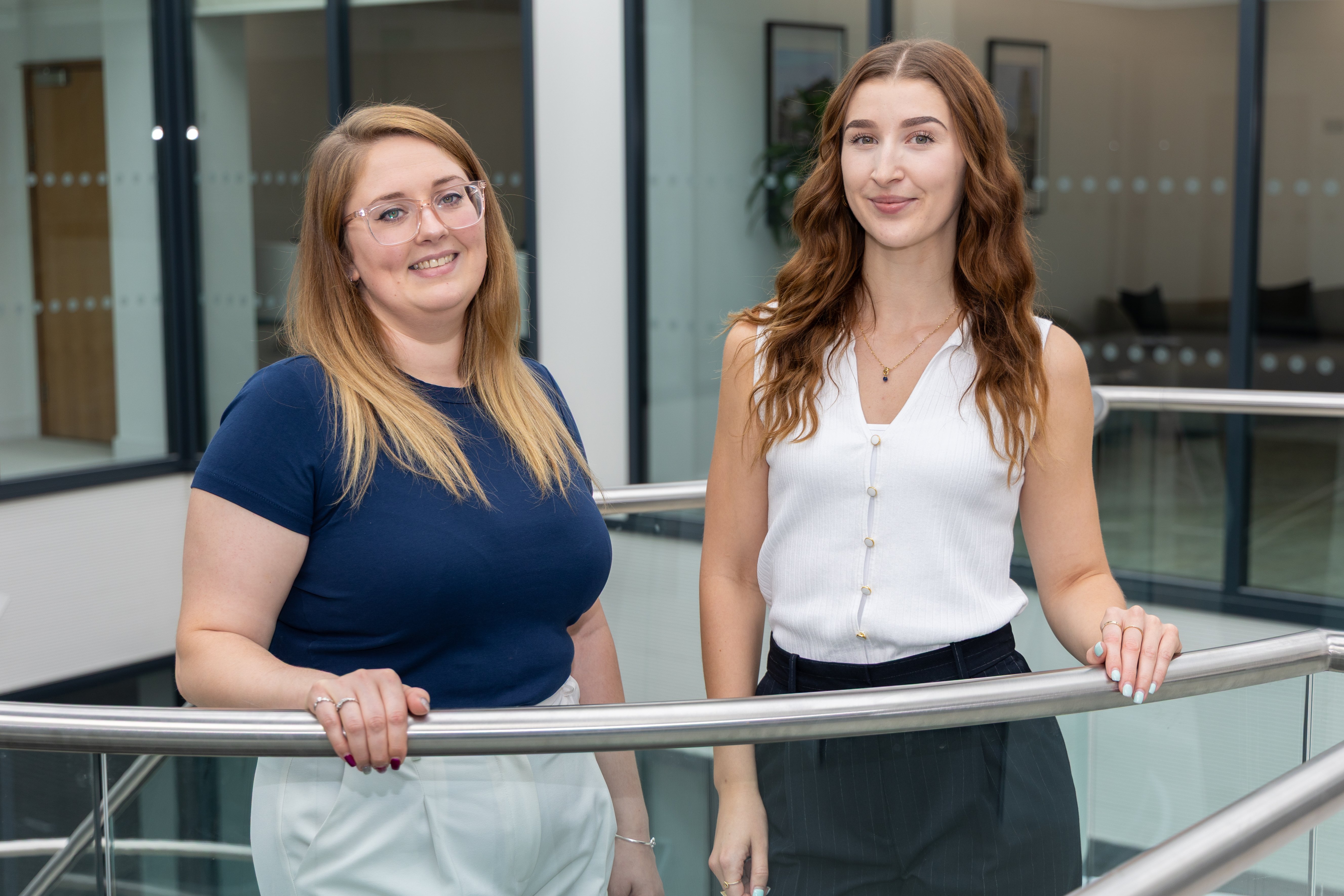  
Jess Fry and Deanna Graddon-Davis standing at top of stairs
