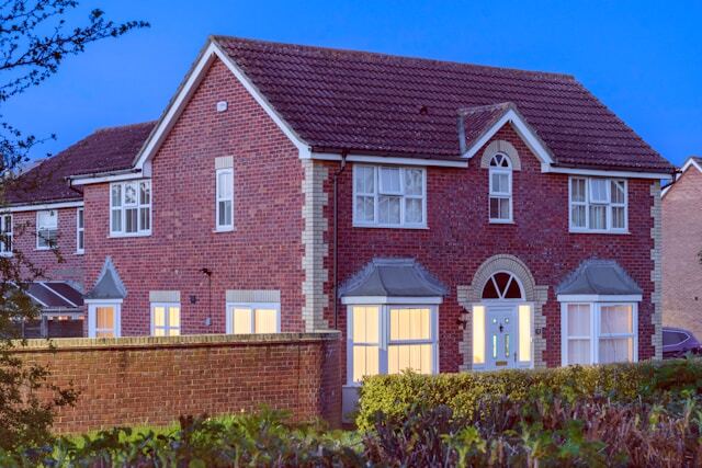 House with downstairs lights on